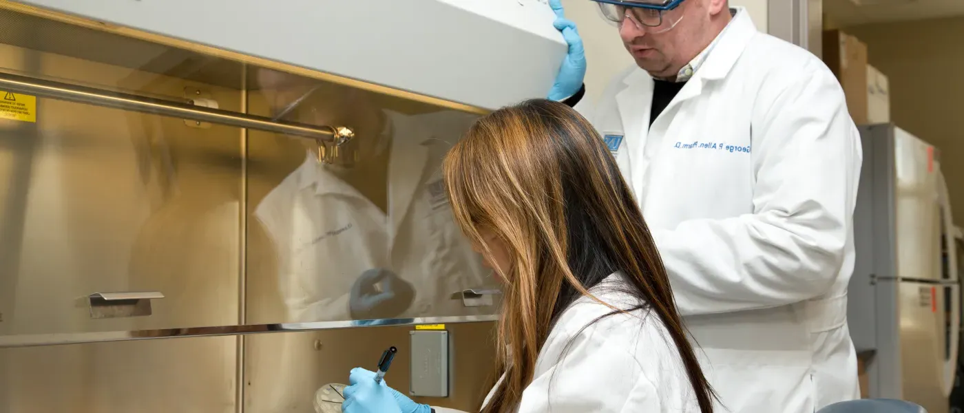 U N E College of Pharmacy student at lab bench