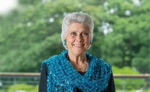 Portrait of Marilyn Gugliucci against trees on the Biddeford Campus